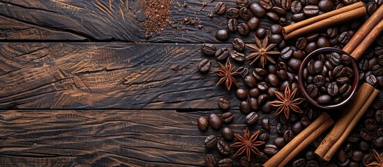 Poster - Top view of roasted coffee beans cinnamon sticks and star anise arranged on a rustic wooden backdrop with ample copy space image