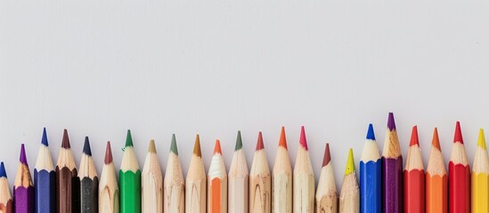 Aufkleber - A lineup of colorful pencils on a white background with room for text in the image. Creative banner. Copyspace image