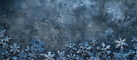 Fototapete - Unique Christmas backdrop featuring blue snowflakes on a dark gray background with space for additional images