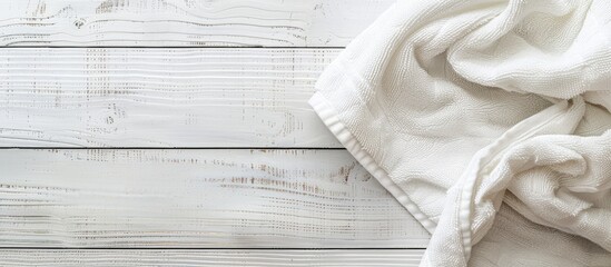 Canvas Print - White wooden surface showcasing a towel with copy space image