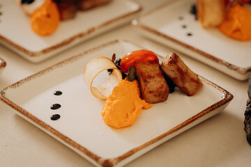 Assortment of delicious snacks on the open buffet festive table in restaurant. Catering plate