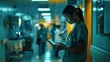 © Miso Ai - A female nurse in scrubs uses a tablet in a hospital hallway.  The image conveys a sense of urgency and focus.