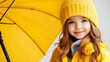 © MonkaLemonka - portrait of small 6  - 7 years old girl in yellow raincoat with yellow umbrella outside; smiled kid under the rainy weather; autumn/fall background; copy space