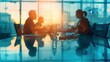 © Miso Ai - Silhouettes of business people meeting around a table in an office with a view.