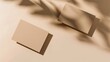 © YanabY - Soft Light Illuminates Minimalist Beige Cards on a Sunlit Surface With Gentle Shadows