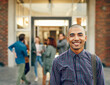 © peopleimages.com - Portrait, happy man or student on outdoor campus in university for opportunity, future or study in college. Confident, biracial person or proud scholar with smile for school, education or scholarship