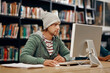 © StarDweller/peopleimages.com - Student, computer and research in college library for programming course, exam and information technology. Classroom, man and learning in university for education, app development and school project