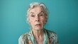 © Business Pics - Turquoise background sad European white Woman grandmother realistic person portrait of young beautiful bad mood expression Woman Isolated Background