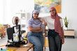 © Studio Marmellata - Two women in hijabs pose confidently in a 3D printing lab, surrounded by equipment and tools. Their stance reflects confidence and pride in their work and achievements in technology.