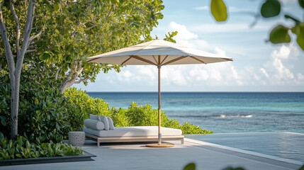 Wall Mural - Sun lounger with  sun umbrella near thw pool on a tropical sandy beach with blue ocean view