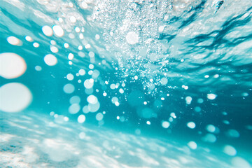 Sunlight dances on turquoise water, creating a calming bokeh effect. Sparkling and pure, the liquid invites relaxation on a perfect summer day. Underwater background