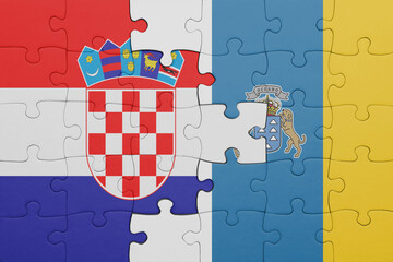 puzzle with the colourful national flag of canary islands and flag of croatia.