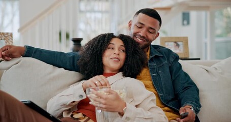 Poster - Black couple, popcorn and streaming movies in home, subscription and film snack for television. People, relax and remote for choosing entertainment in lounge, hug and couch together for marriage