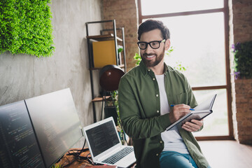 Sticker - Photo of professional it specialist young man write notepad computer desktop loft interior office indoors