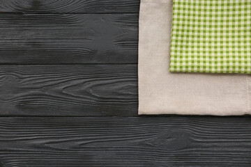 Wall Mural - Fabric napkins on black wooden background