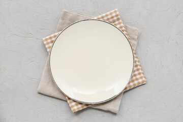 Wall Mural - Table setting with napkins and plate on grey grunge background