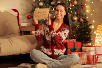 Poster - Young happy woman holding letters to Santa at home. Christmas concept