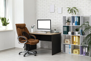 Poster - Interior of light office with workplace, armchair, modern computer and shelving unit