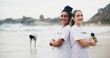 © peopleimages.com - Team, portrait and volunteer at beach for cleaning, recycling and environment sustainability with smile. Woman, ngo and crossed arms by ocean for community service, charity and cleanup collaboration