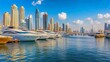 © Yusif - The United Arab Emirates: The Dubai Waterfront. Along the banks of the Dubai lagoon, high-rise modern buildings line the waterfront, and numerous boats are moored nearby.