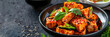 © KALEYA - Spicy Tofu with Sesame Seeds and Basil in Black Bowl - Realistic Food Photography