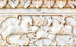 © zenobillis - An ancient bas-relief of hindu deity made of stone carved on the wall of a palace in Jaipur, India