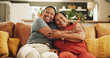 © AzeemudDeen/peopleimages.com - Happy, hug and portrait of black woman with senior mother on sofa in home for womens day celebration together. Smile, bonding and African female person embracing mom for connection in living room.