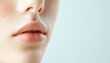 © Sagiam - Close-up of natural, delicate lips and smooth skin in a minimalistic light setting. Ideal for beauty and skincare themes.