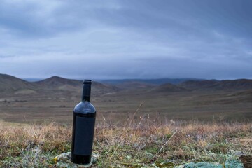 Poster - Bottle of wine in the mountains