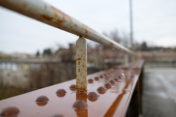 Old rusty railing of a small bridge