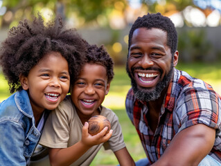 A man and two children are smiling and holding an apple. Scene is happy and joyful