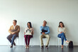 © peopleimages.com - Interview, people and bored in waiting room for business, job opportunity and thinking in office. Recruitment, candidates and inclusion in onboarding for diversity, hiring and applicants at agency
