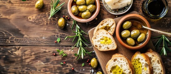 Wall Mural - freshly sliced bread served with olives and olive oil accompanied by balsamic vinegar in a bowl on a