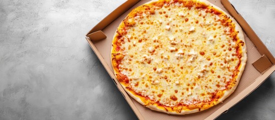Aufkleber - Cheese pizza in a carton box on a gray background top view with room for text Food delivery service. with copy space image. Place for adding text or design