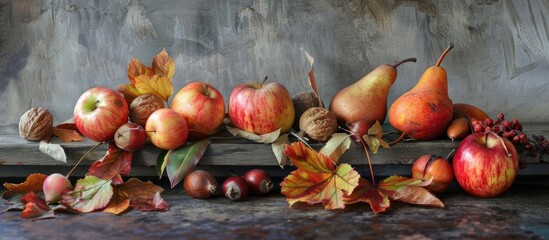 Canvas Print - Autumn still life from above Apples pears fallen leaves and chestnuts on a gray backdrop. with copy space image. Place for adding text or design