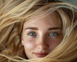 © Pekr - swirl of straight blond hair covering frame with closeup of a blonde happy female 20 years old face in the center