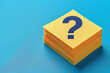 © TAMER YILMAZ - Paper cards with question marks on a blue background. Stack of question marks, top view with space for text