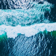 Sticker - Aerial view beautiful of sea waves from drone. Stock image of blue color of ocean water, sea surface. Top view on turquoise waves, clear water surface texture.