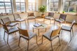 © Man888 - Circle of empty chairs in a therapy room, a few scattered notebooks and pens, with a subtle background of calming colors, conveying support and recovery.