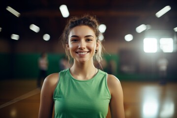 Wall Mural - Smiling portrait of a female Caucasian teenage basketball player