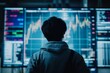 © Asmaa_Asmadi - a man is standing and watching stock market