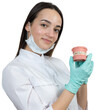 © Mountains Hunter - Girl doctor dentist in a white coat holds a mock of teeth.