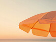 © Amy - Vibrant Orange Beach Umbrella at Sunset by the Sea