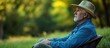 © vxnaghiyev - Lifestyle and relaxation concept for mature individuals Older man resting in nature. with copy space image. Place for adding text or design