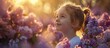 © vxnaghiyev - Joyful childhood the girl an area for text outdoor children sunset and lilac flowers selective focus. with copy space image. Place for adding text or design