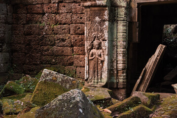 Wall Mural - Angkor Thom, ancient temple ruins in Cambodia jungle with tree roots