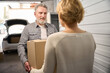 © Svitlana - Clients in storage unit holding carton parcel