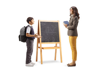 Sticker - Full length profile shot of a schoolboy talking to a teacher in front of a blackboard