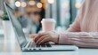 © olegganko - Person Typing On Laptop In Coffee Shop During Daytime