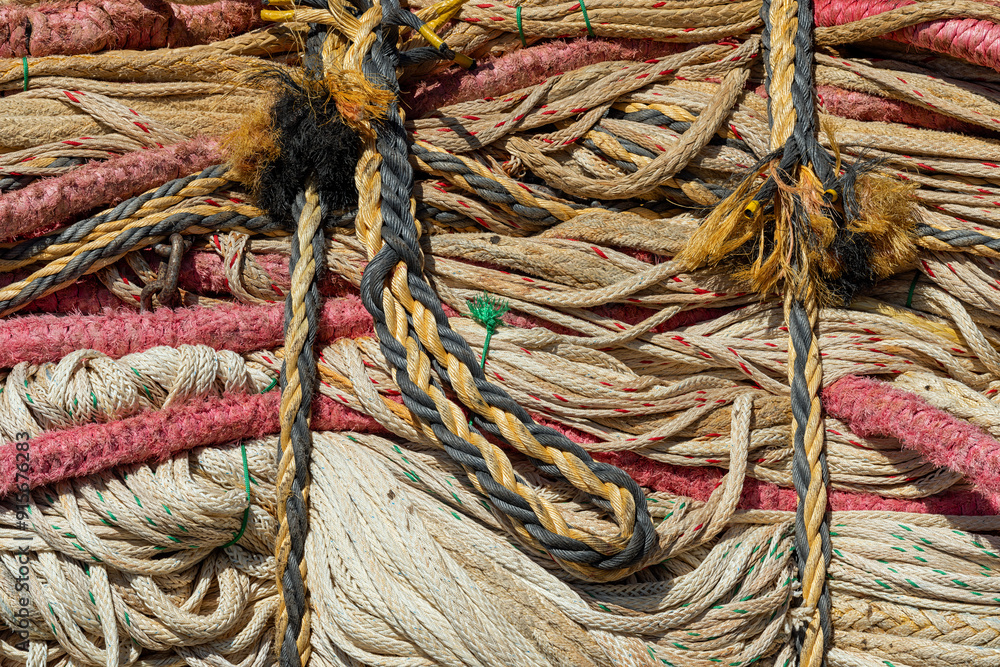 many types of ship cables and ropes in a big heap